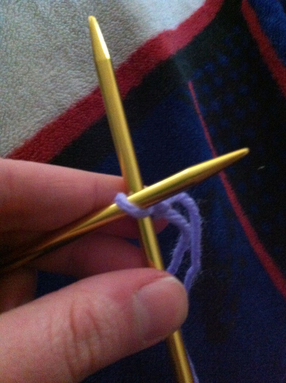 Insert right needle into stitch as if to knit (from fron to back).