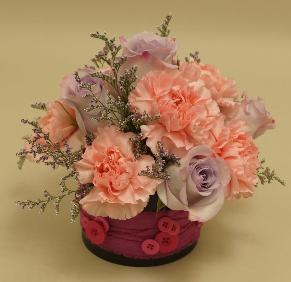 Insert roses and limonium into foam.