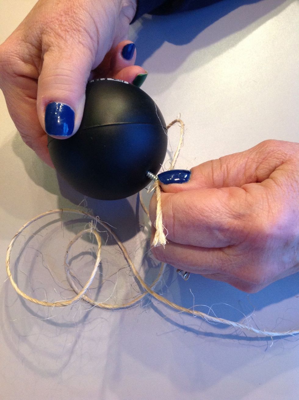 Insert screw into the ball.