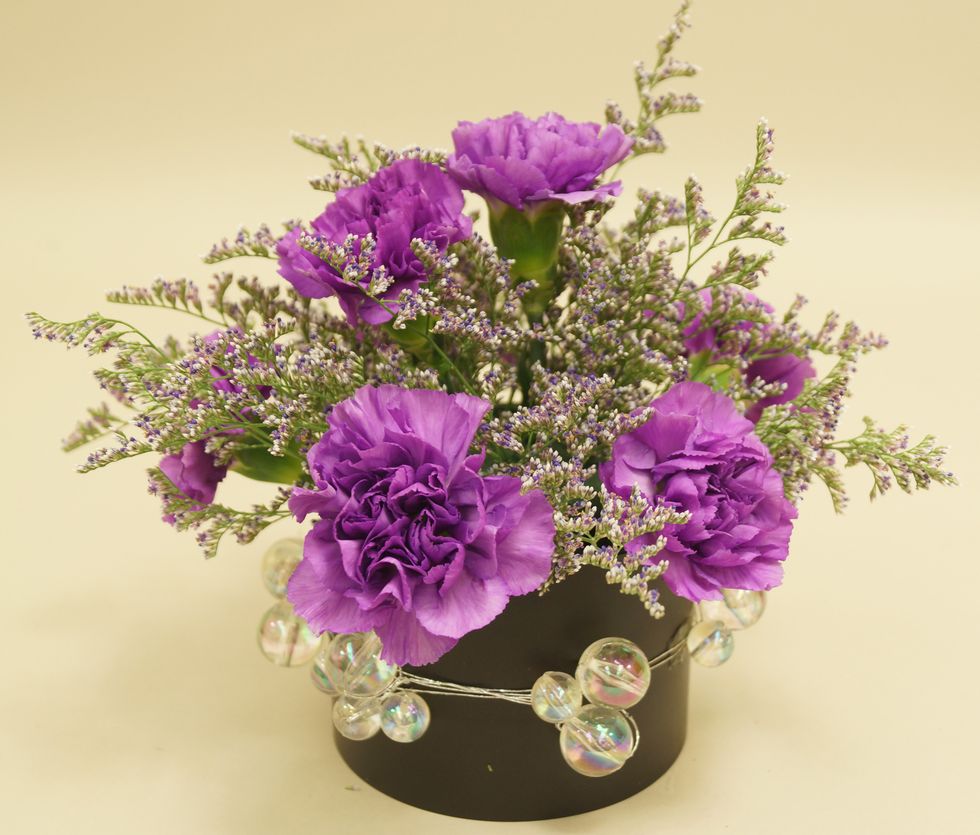 Insert stems of limonium into foam.