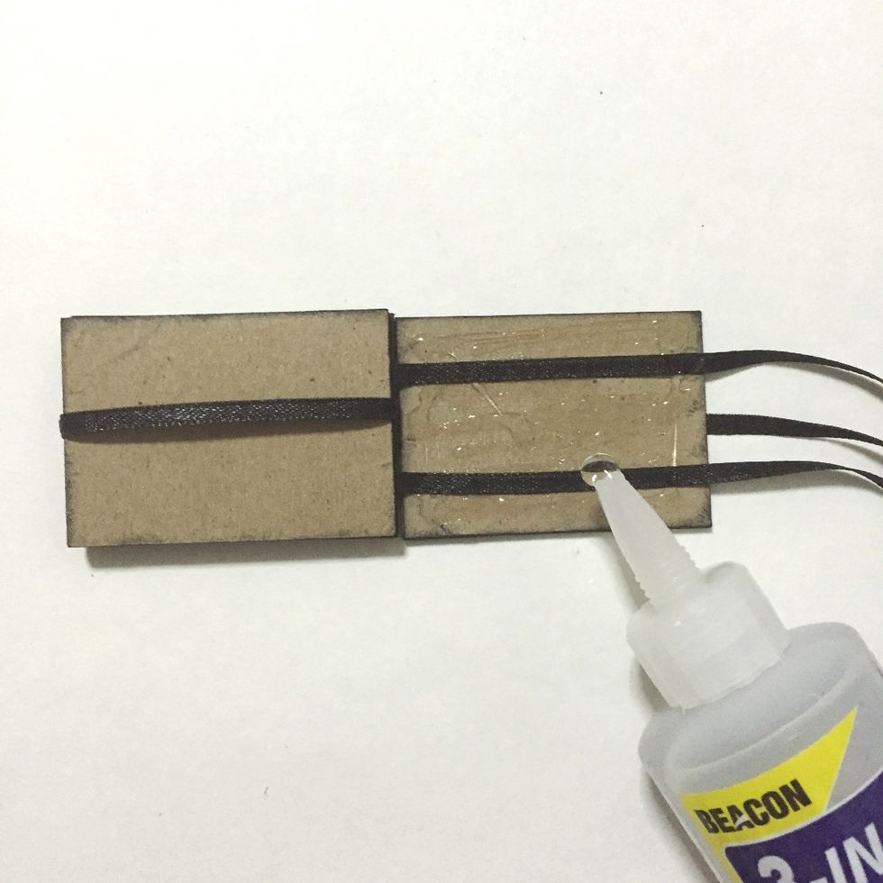 Insert the 4th number block into the loop on the left as shown... And apply glue onto the 3rd number block...