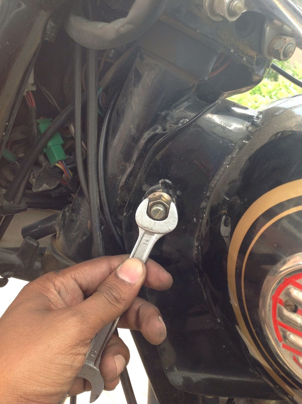 Insert the bolts without scratching the threads on the bolts and tighten with the nuts using a 14mm spanner hold the bolt using a same size spanner from the other side.