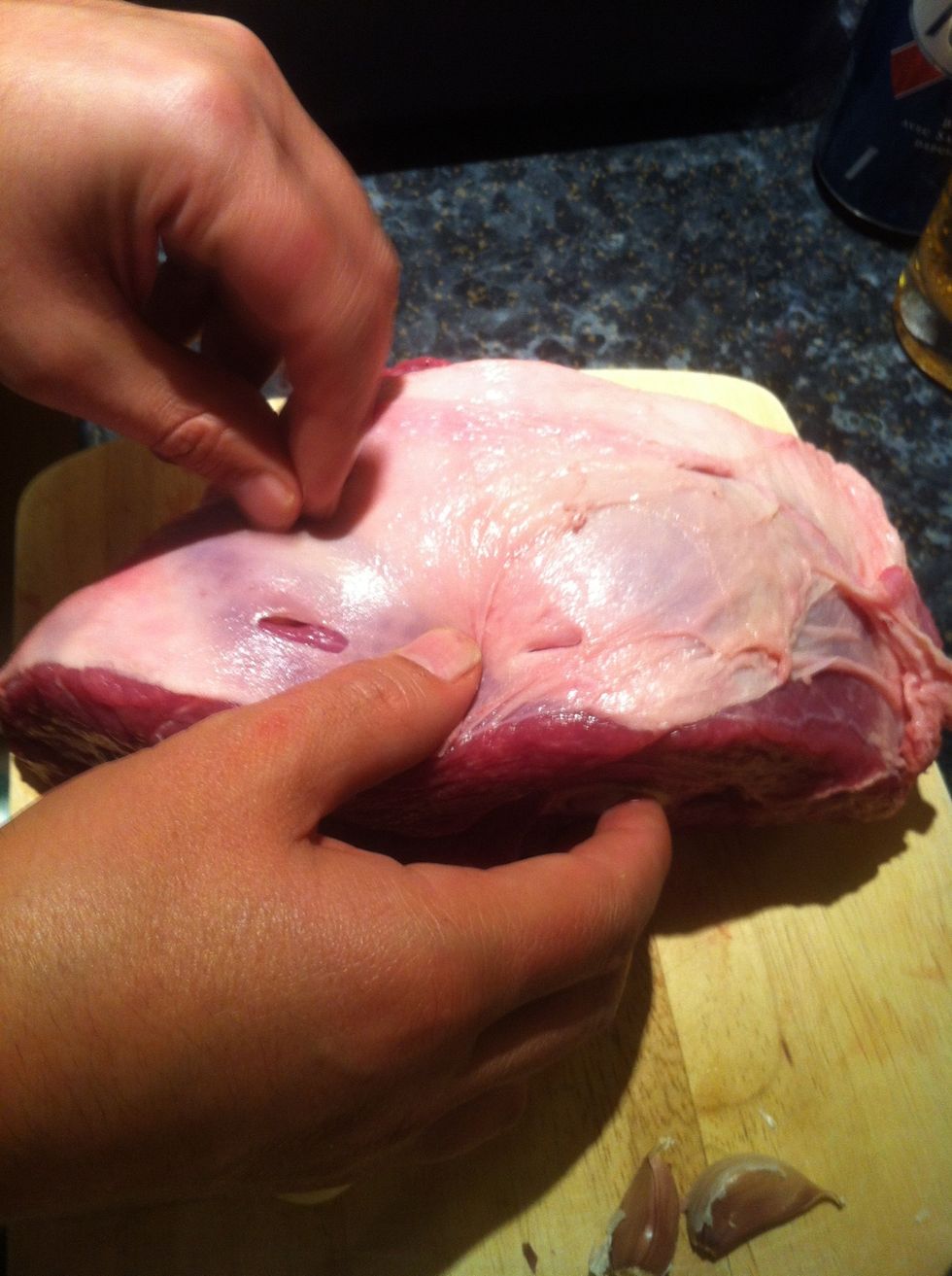 Insert the cloves into the lamb