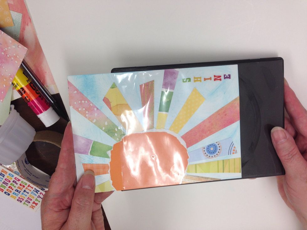 Insert the front and back covers into the DVD case.