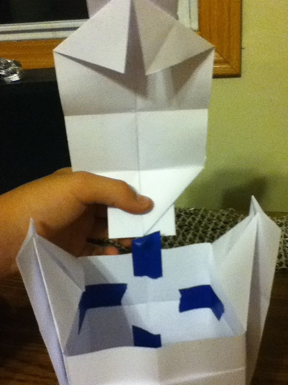 Insert the last piece and tape it here.