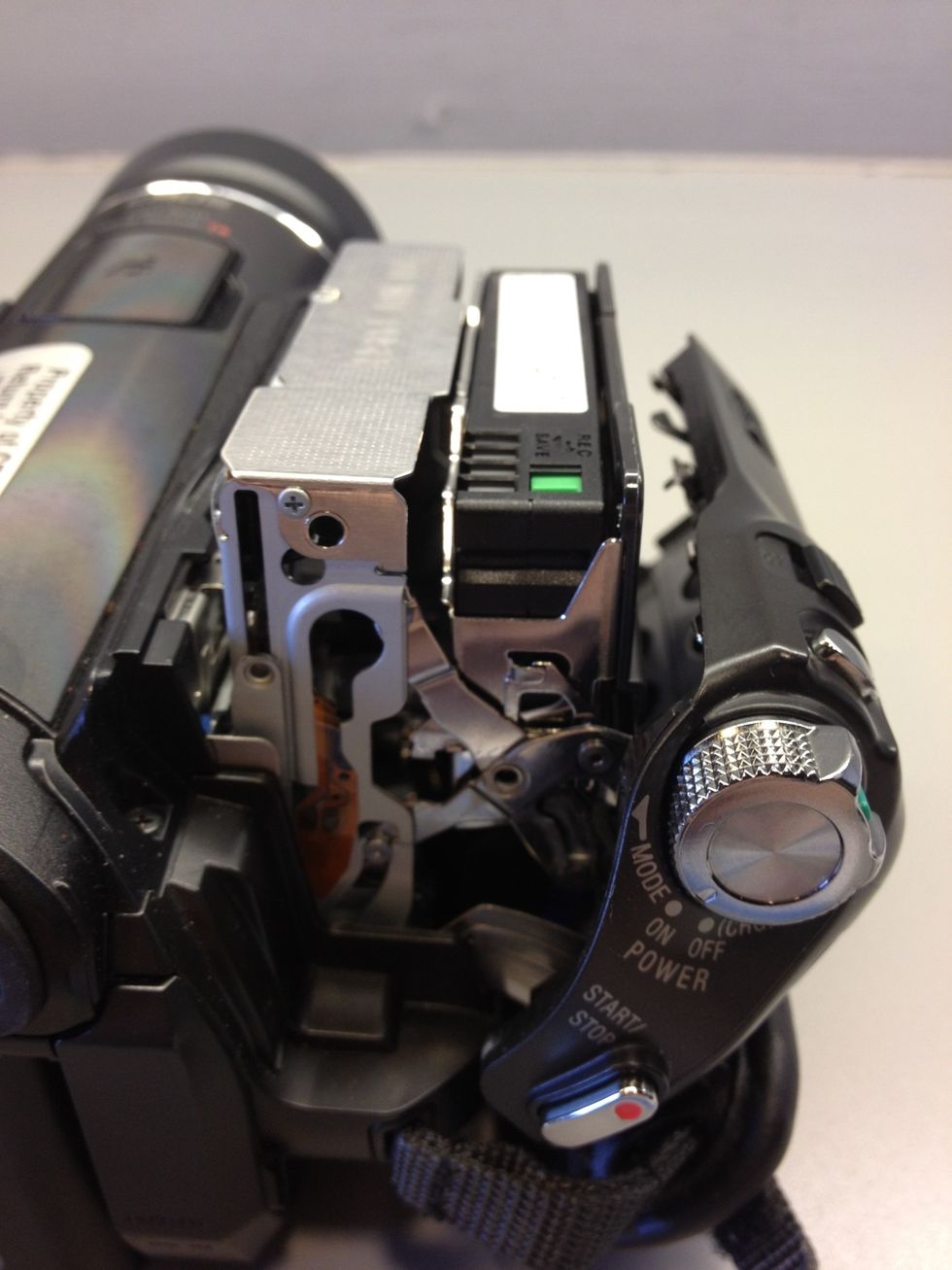 Insert the miniDV tape. Push the side to close being careful to not force the cassette in or out.