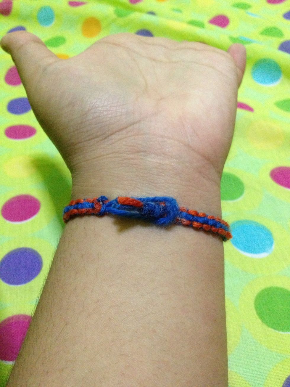 Insert the overhand knot you just made in the loop and you're done. If it slips, then make an adjustable knot. Or make some adjustments so that it will not slip again.