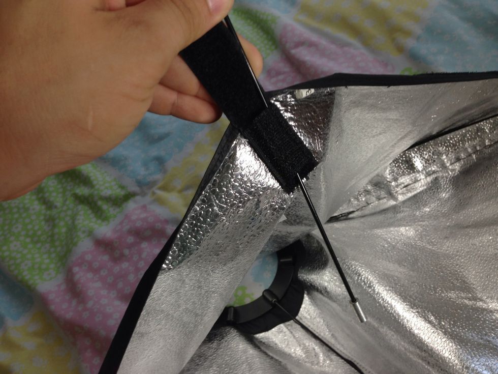 Insert the pin through the Velcro pocket