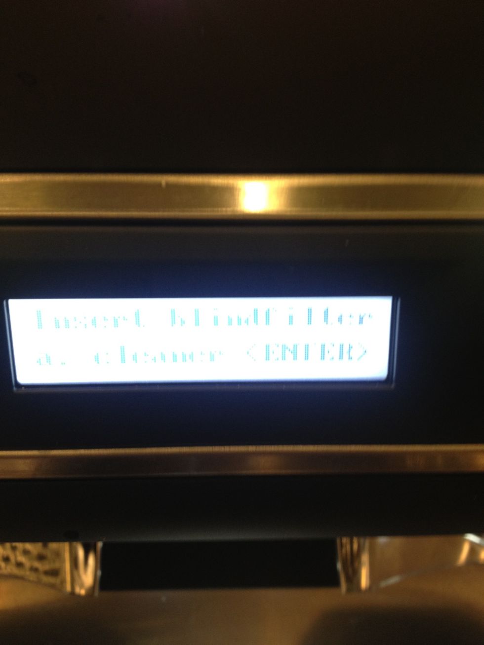 Insert the portofilter as instructed