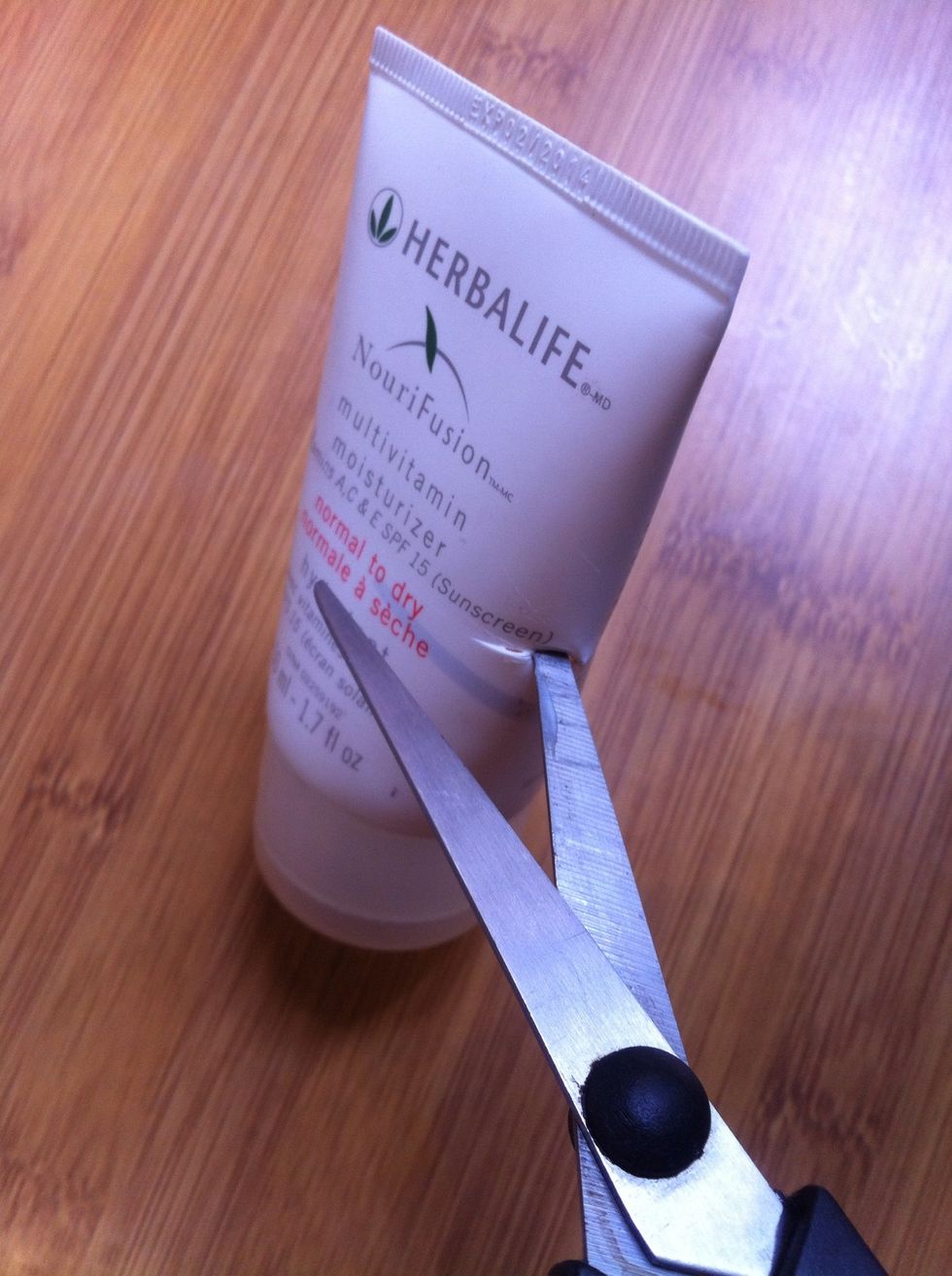 Insert the scissor in the small whole you've just made and..