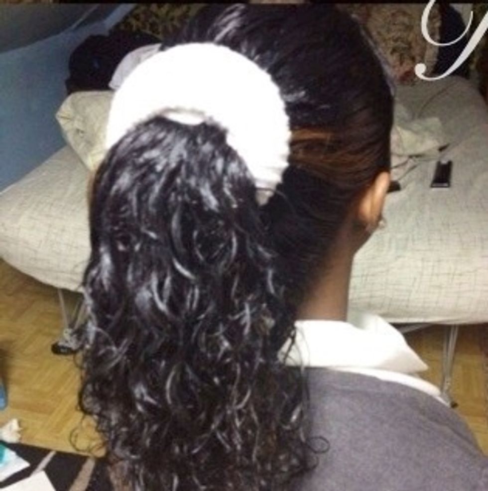 Insert the sock through the ponytail.