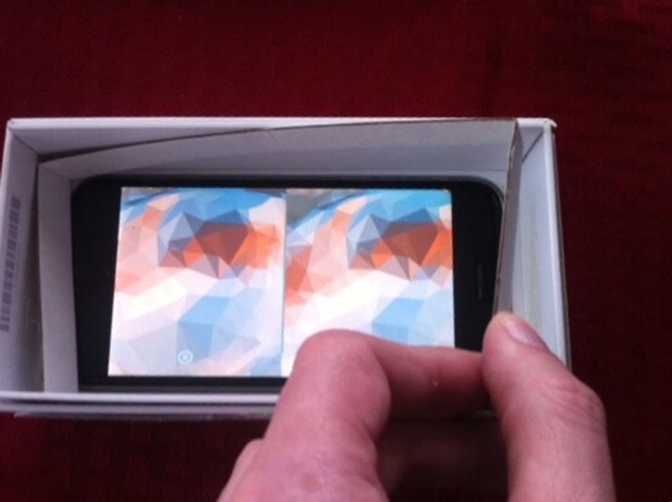 Insert the thin cardboard strip that goes all the way around the inside of the box.