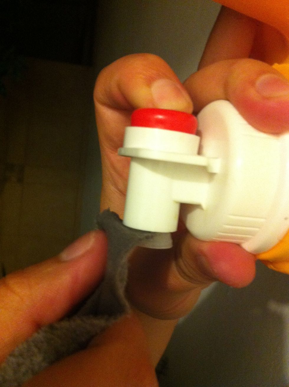 Insert the tip of the triangle in the valve.