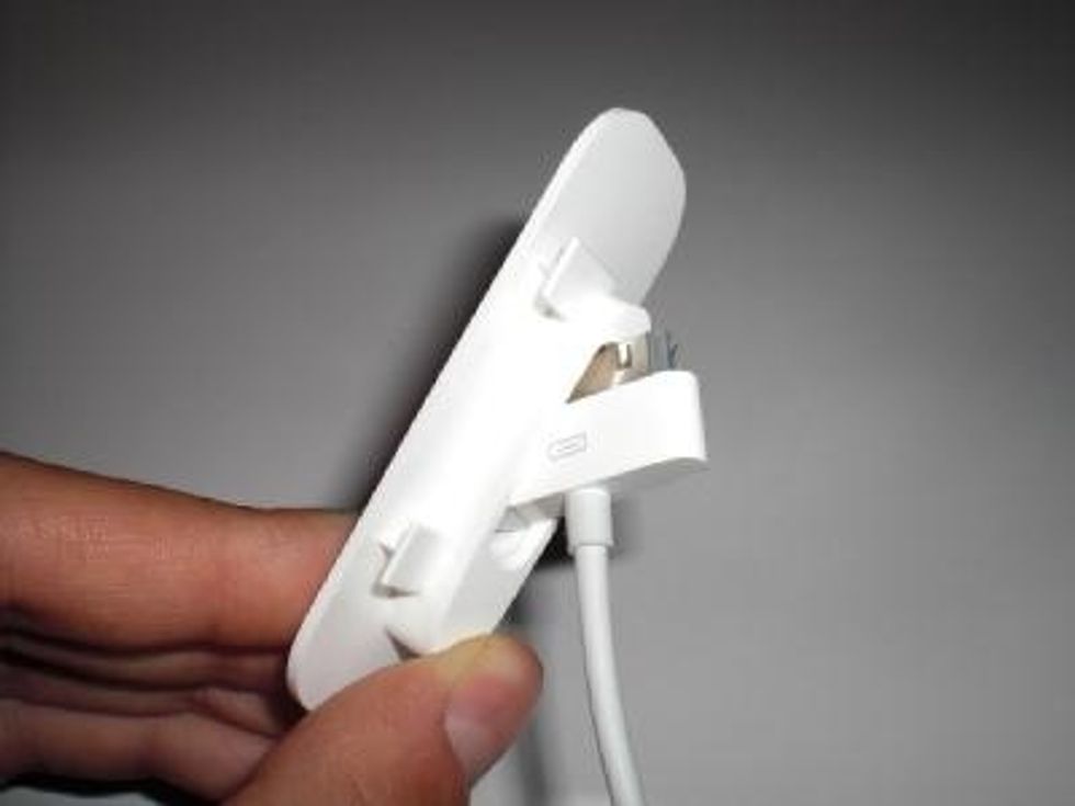 Insert the USB cable through the dock adaptor.