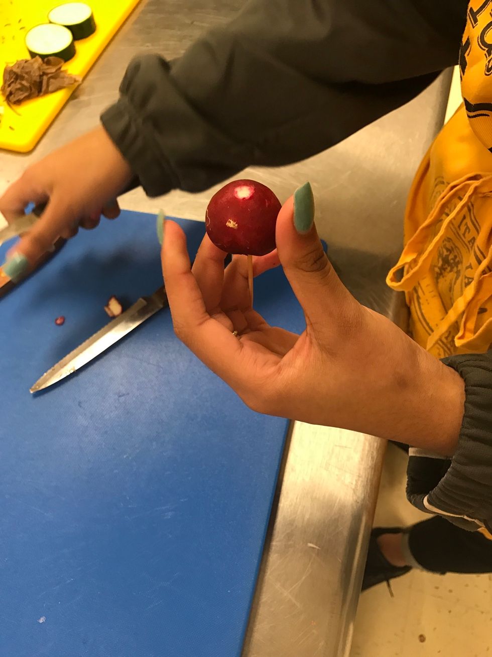 Insert toothpick to make it easier to handle and as a guide to carving the stem