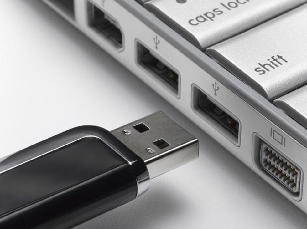 Insert USB Drive into port. Don't force it, if it doesn't fit well it may not be the right place.