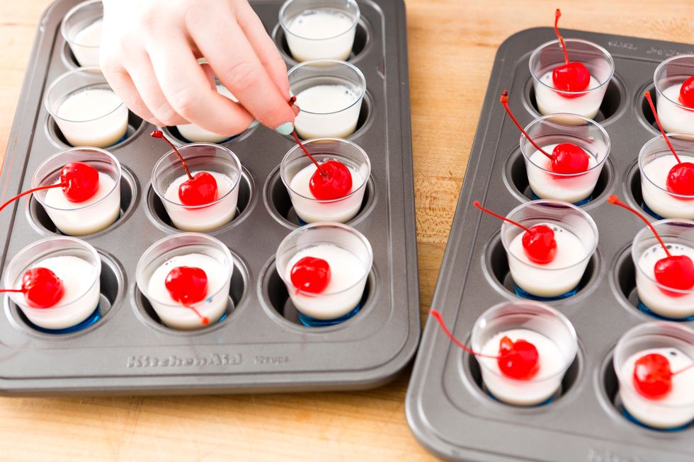 Insert your cherries into the white gelatin layer and refrigerate for another 2 minutes.
