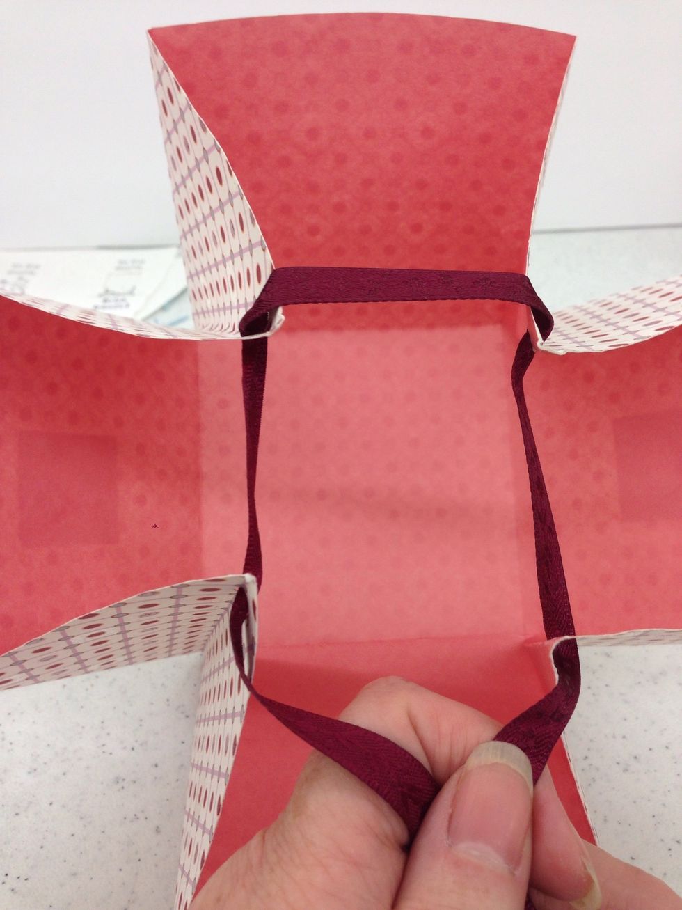 insert your gift in the basket, then gently pull the ribbons together and tie them into a bow.