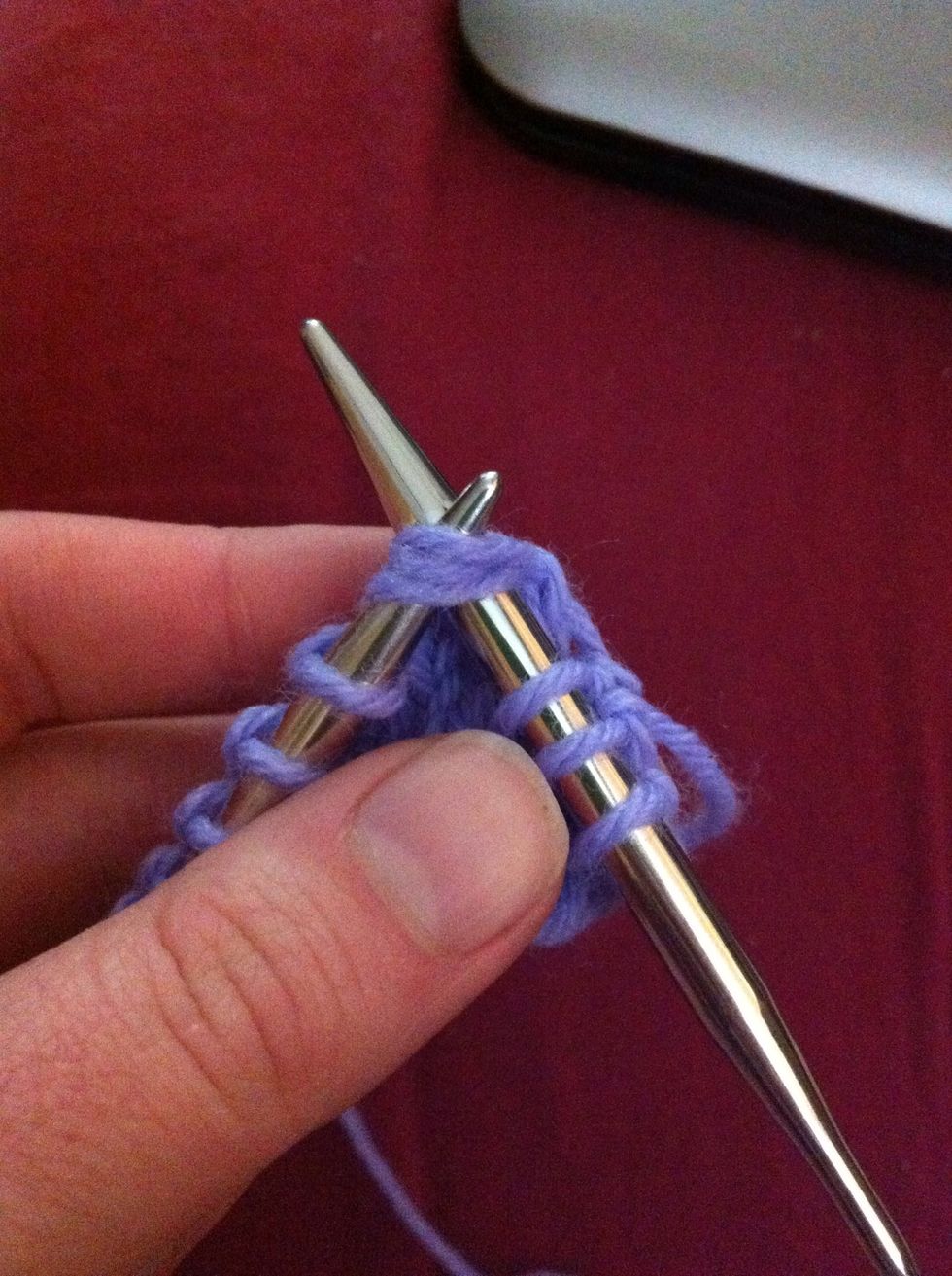 Insert your right needle through the first three stitches on the left needle from front to back as if to knit.