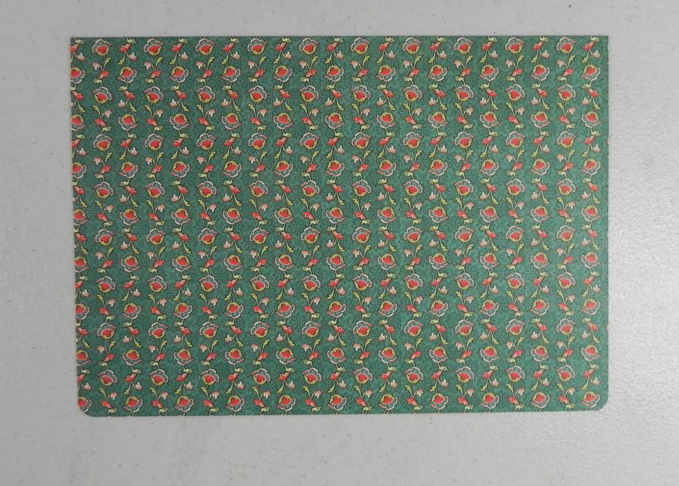 Inside bottom cover, cut out of pattern paper: 7 1/2 x 5". Punch the bottom corners with a 1/4" corner punch. Ink edges.