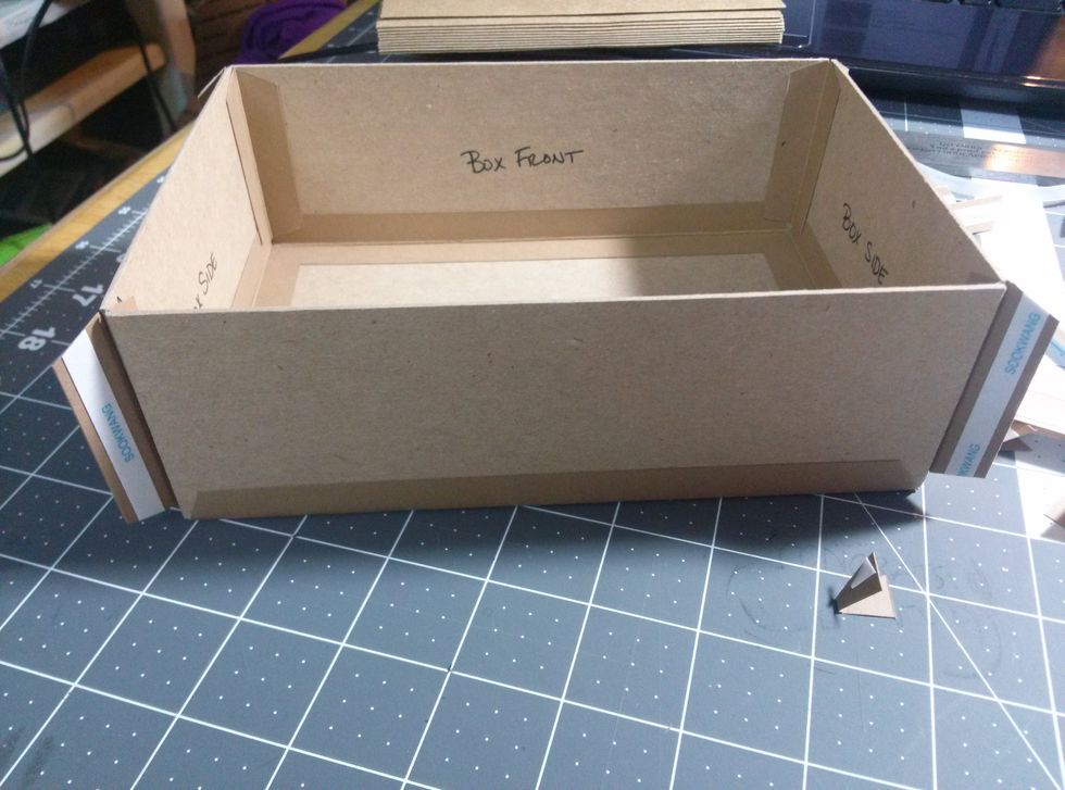Inside of box showing construction strips and outside stripes being added.