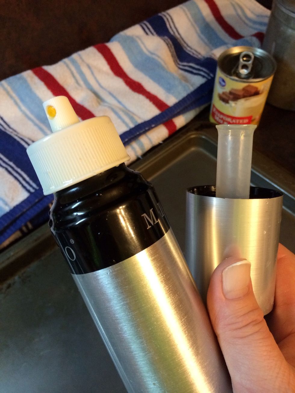 Inside the cap is a pump to allow you to spray.