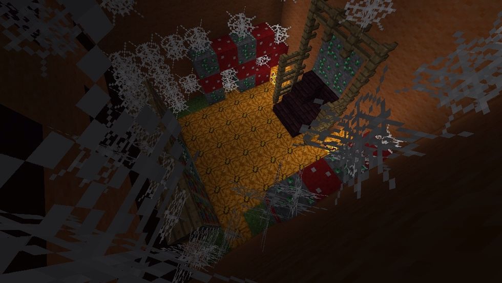 Inside we have a dark room, filled with cobwebs, pumpkins (on the wall and floor), mooshroom blocks for mould and emerald ore for like poison.