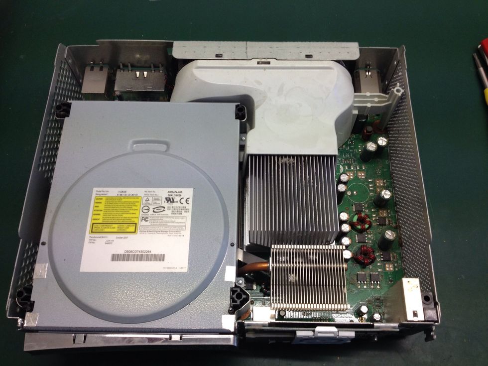 Inside you can see the motherboard, DVD drive and fan shroud. These all need to come out.