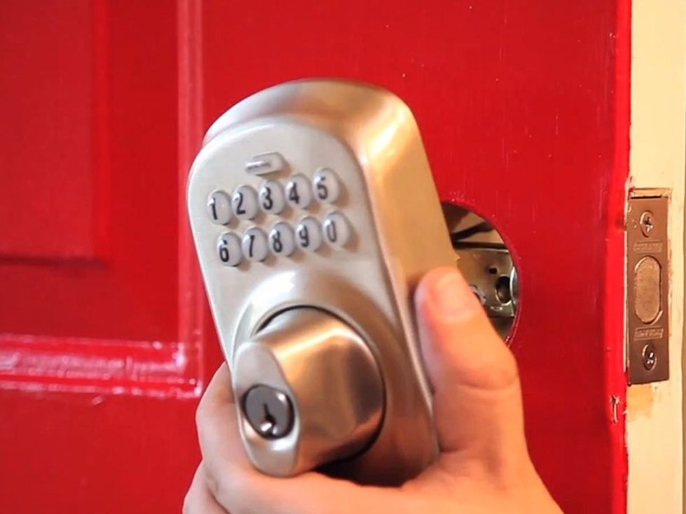 Install the mounting plate to the inside of the door with the provided screws.