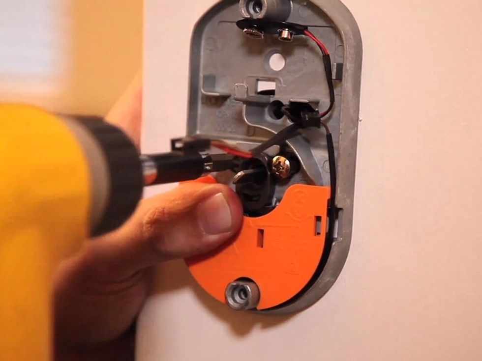 Install the new electronic deadbolt assembly. Align the shank with the hole on the new latch, and allow the deadbolt wiring to pass through.