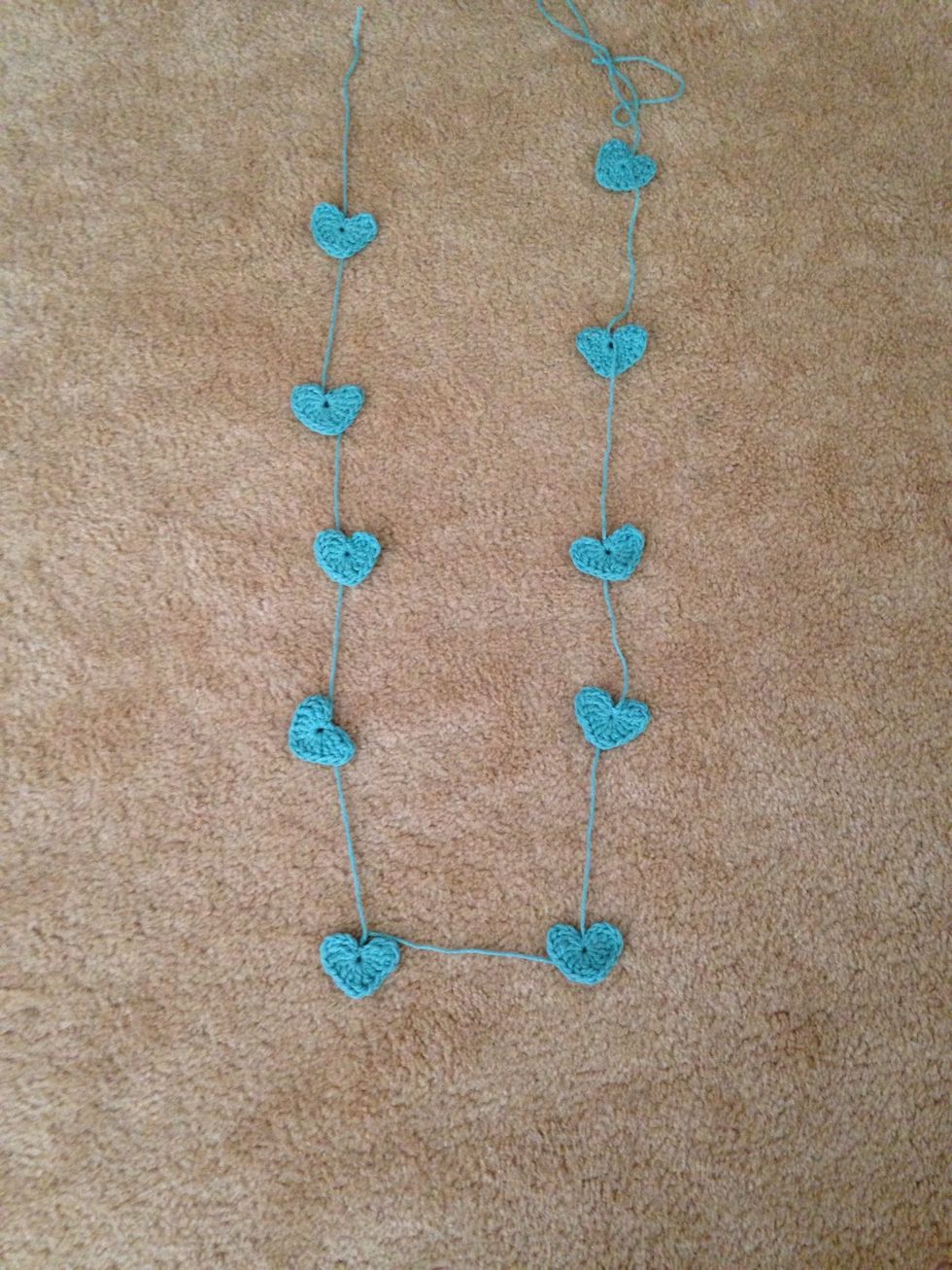 Instead of cutting the string, you can knot and continue a new one and chain the hearts together to make a heart garland!
