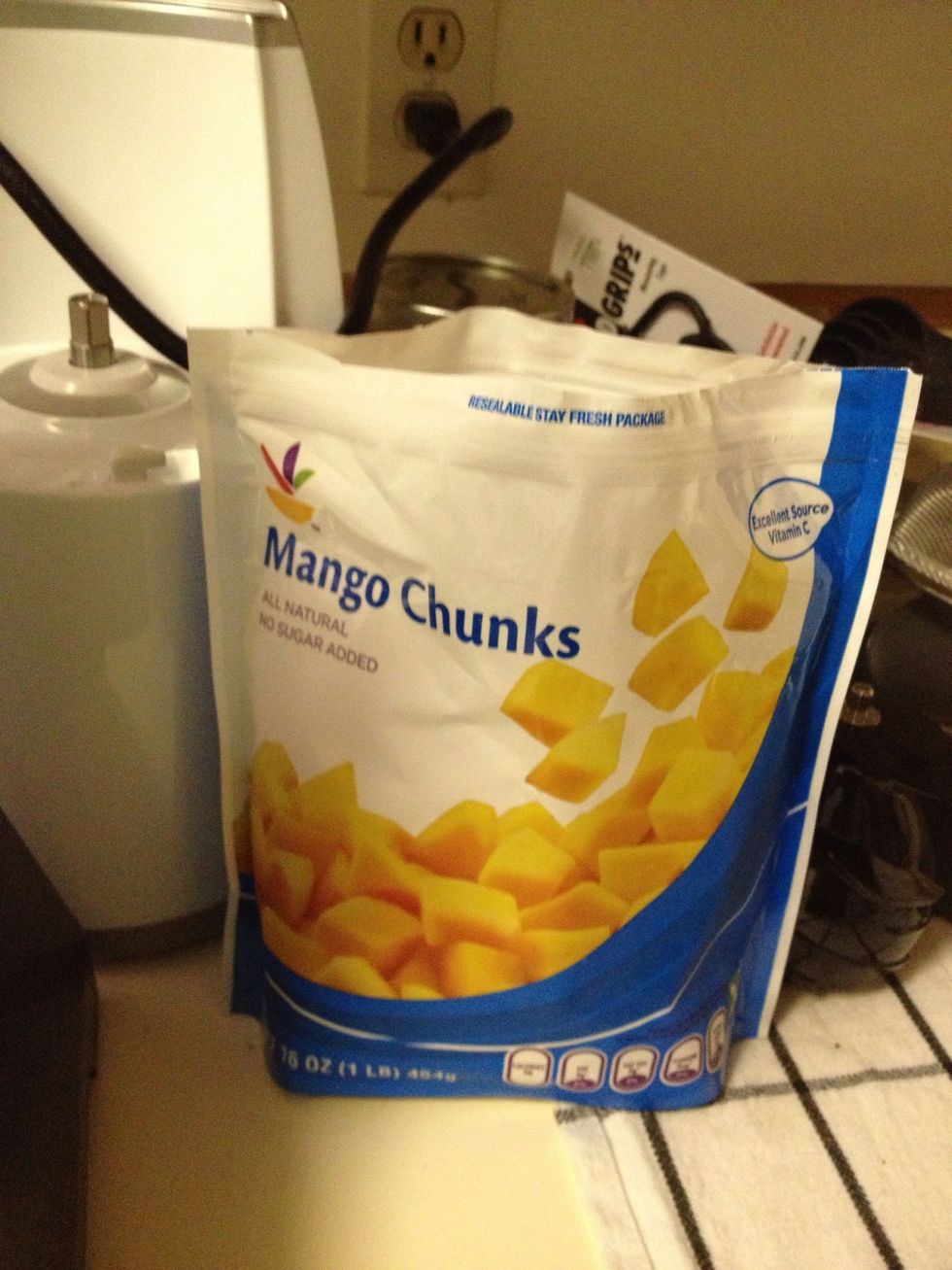 Instead of ice, add some frozen fruit. I chose mango. Sometimes I choose mixed berries but it's always better to drink a cold smoothie and ice can water it down too much and cause separation later on.