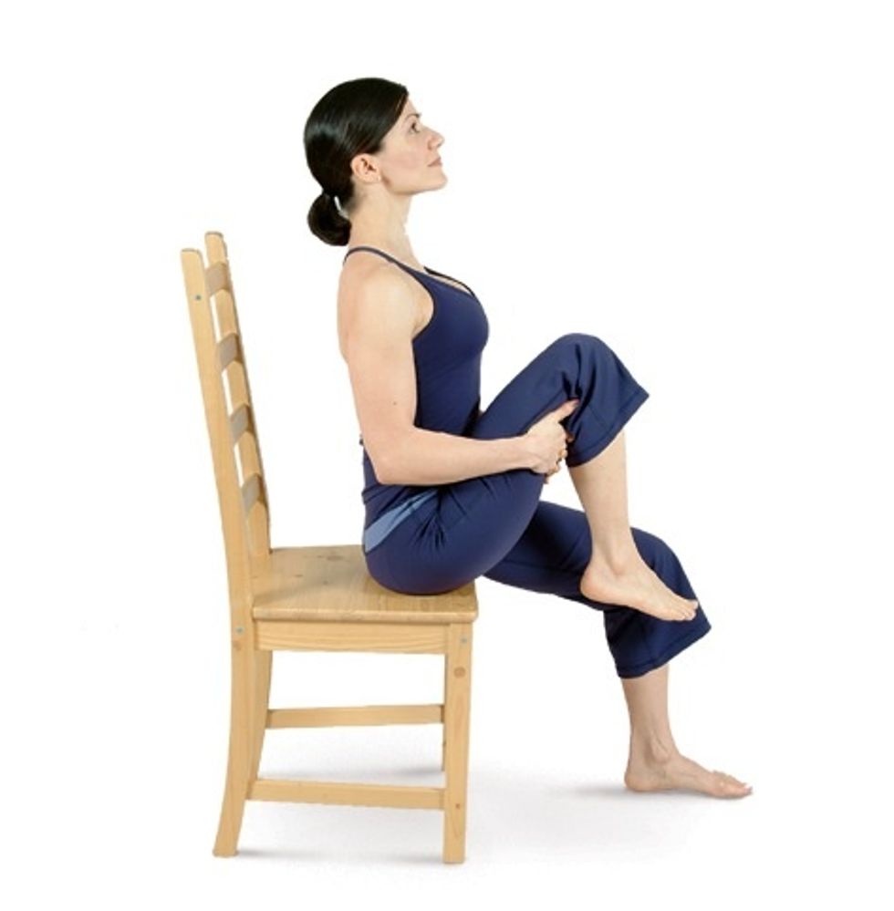 Interlace your fingers under your right thigh & lift your right knee up toward your chest to move into Seated Knee to Chest Pose.