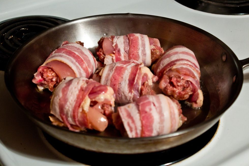 Into a medium hot pan. Ensure that the seam Of the bacon wrap is directly on the pan. This seals the bacon in place, eliminating the need of a toothpick.
