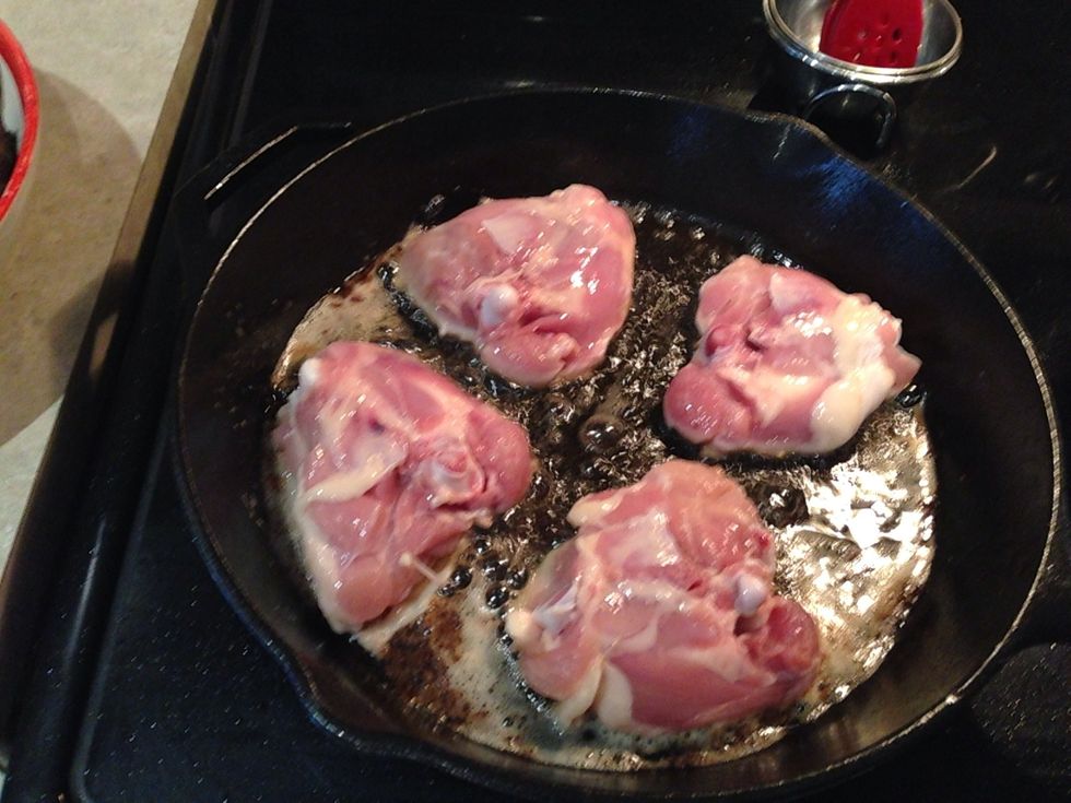 Into the oil go the chicken thighs fat side down. Cook for about 5 minutes on both sides, again not cooking through. Once done add to sauce pot.