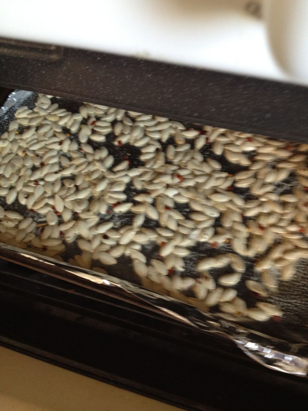 Into the oven! Bake about 10-15 minutes, or until the seeds are light golden brown and crispy.