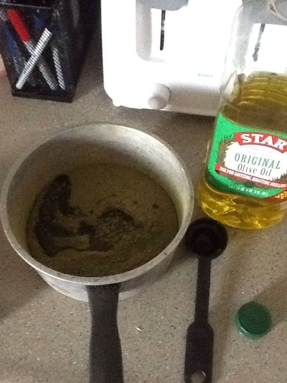 Into your henna, I used Hana brand and emptied the entire sack into the pot, add about 2-3 tablespoons olive oil for added conditioner for your hair ~ the contents of my box was 200 g