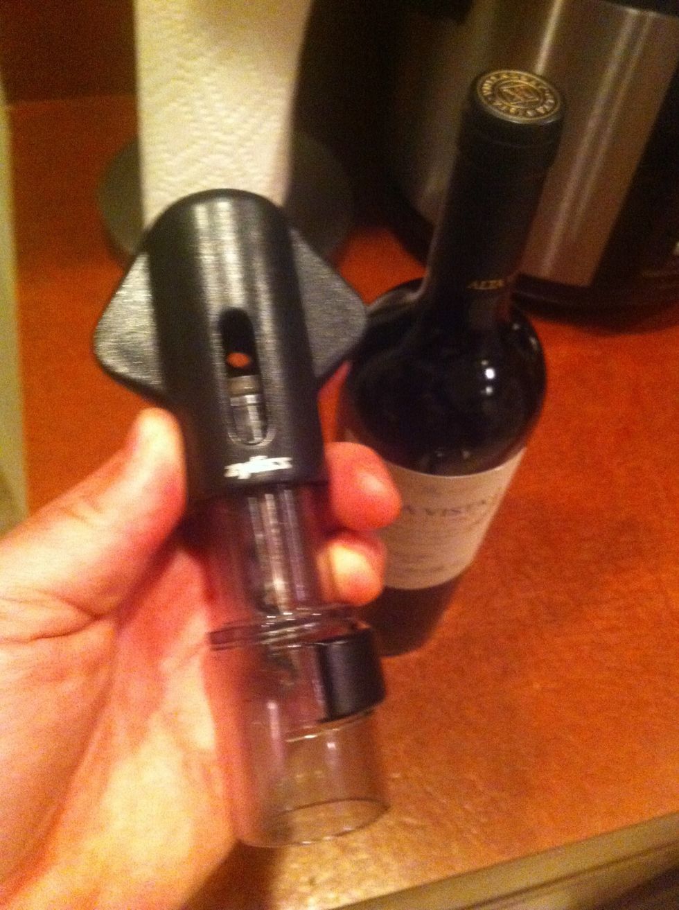 Introduce corkscrew to bottle (they have never met and wine is a polite sport)
