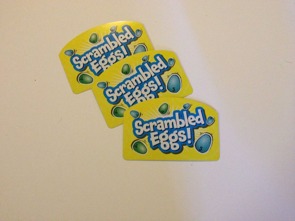 Introduce the Scrambled Eggs cards. Explain that if you draw this card, you get to move around eggs in the nest. This may challenge flexibility skills in learners with autism or other delays.