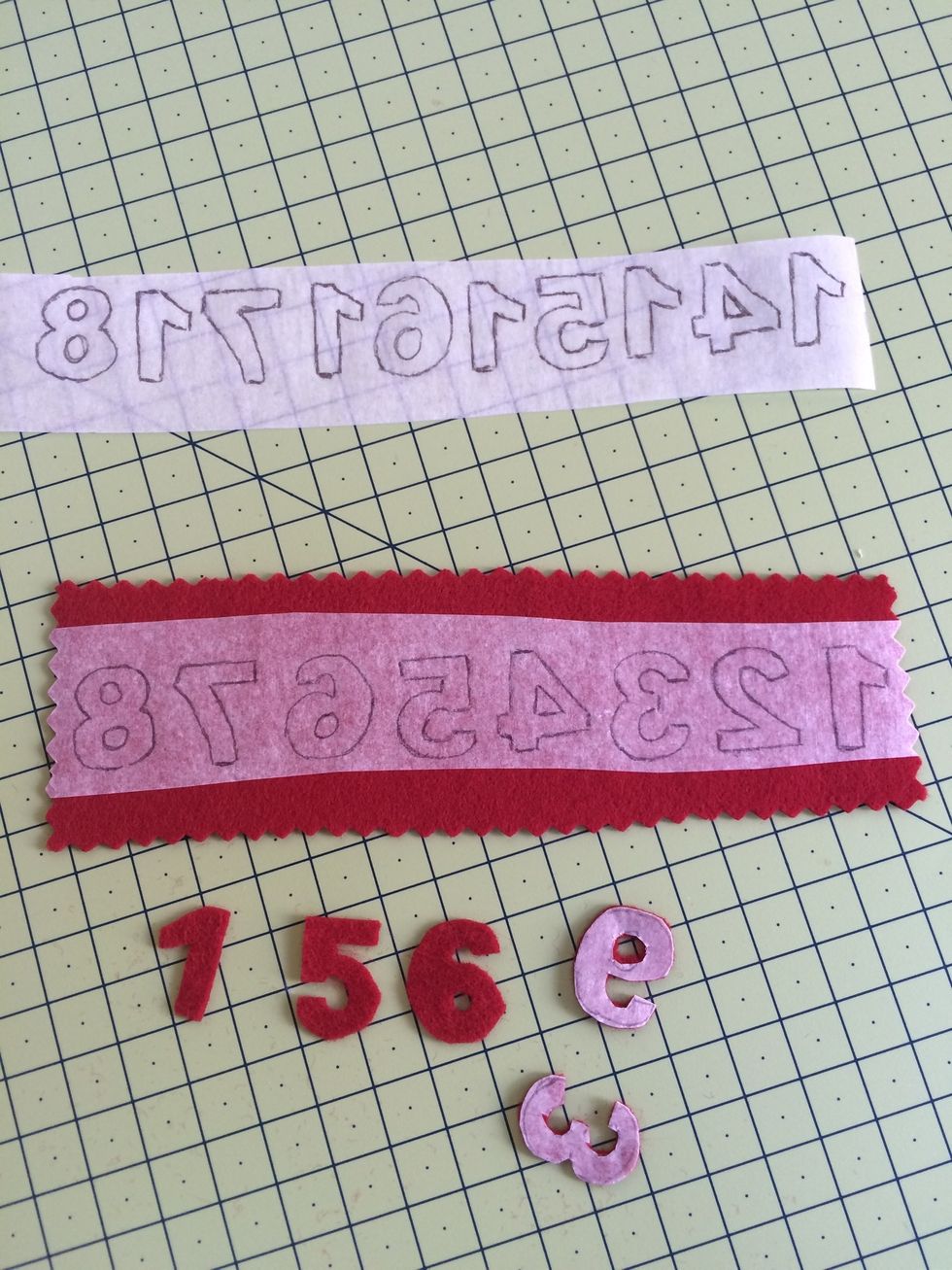 Iron Bondaweb onto felt and cut out the numbers