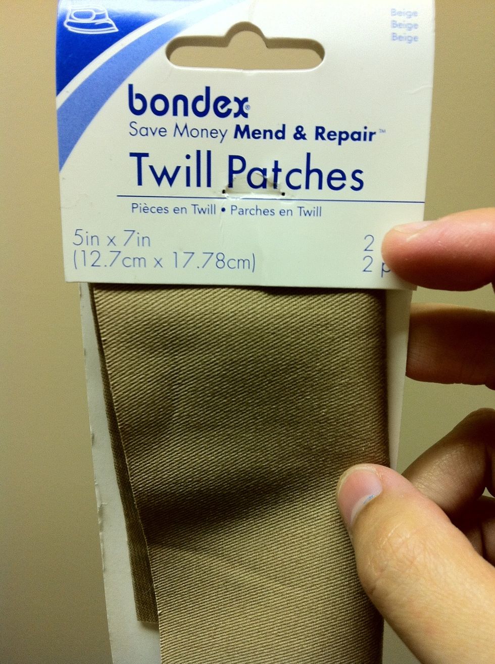 Iron-on fabric patch of any color. You can also use any type of durable fabric. They run around $1.50 at Walmart.