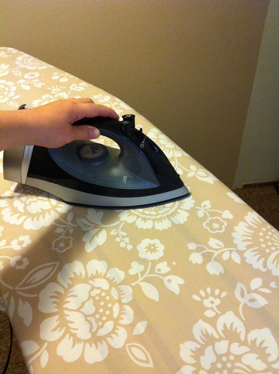 Iron your fabric. I chose to use an old duvet cover that I no longer want for the bedroom. A large flat sheet would be another way to get a large seamless piece of fabric, if you make a large board.