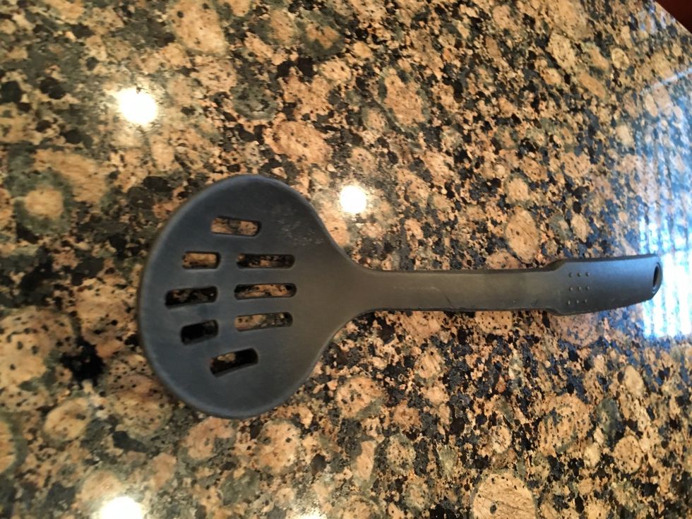 Is a slotted spoon it is used for to let liquid pass through keeping the larger solids on top