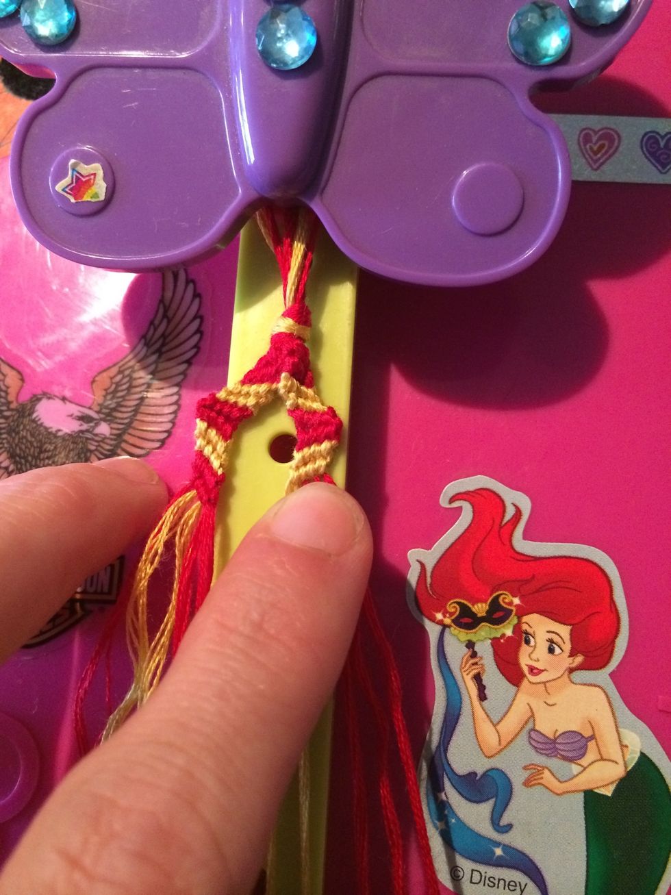 Isn't this looking nice? Grab the red string and knot the 4th row.