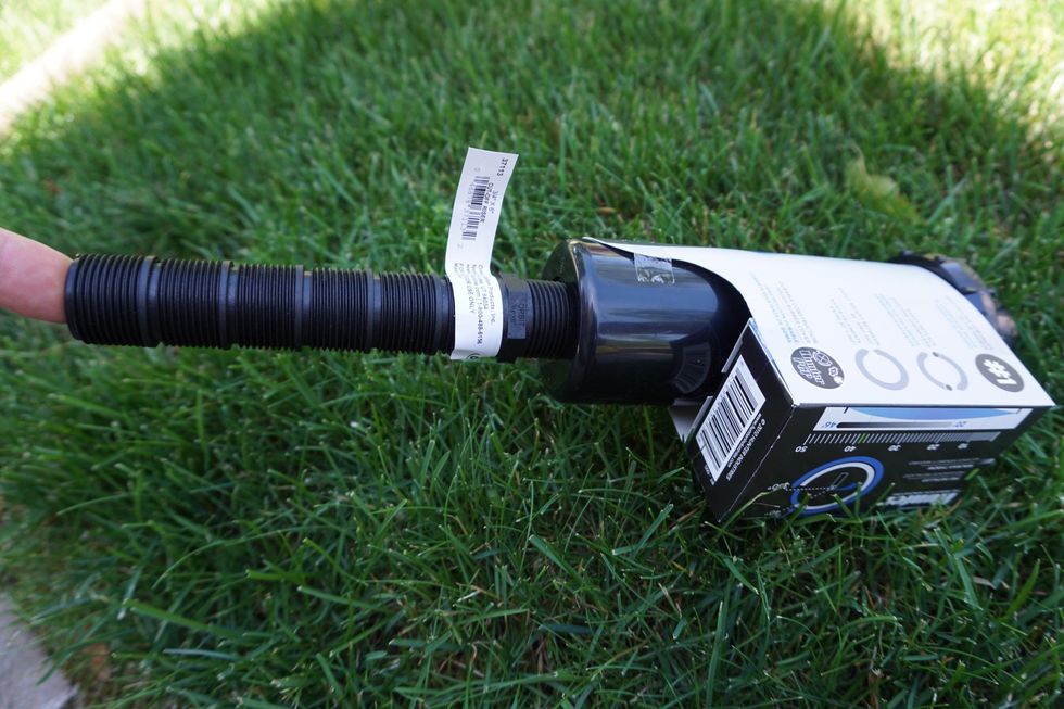 It attaches to the bottom of the head, and I can adjust the height by cutting along one of the slots.