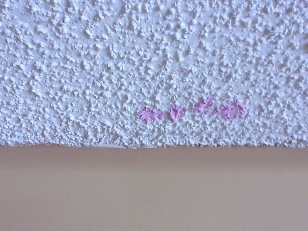 It goes on pink but will dry to white.