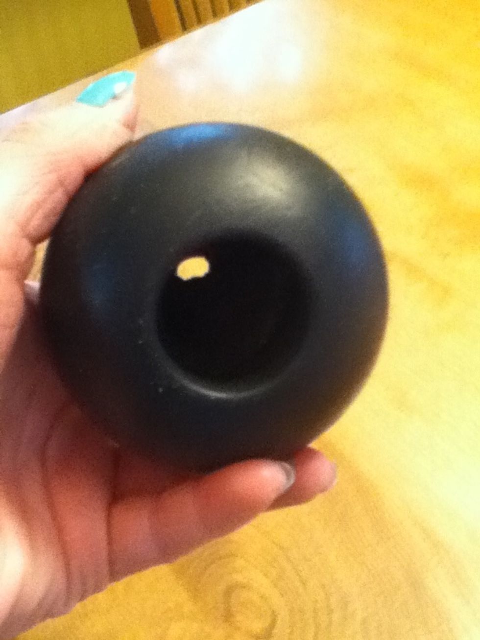 It has a hole in the bottom to put treats inside.