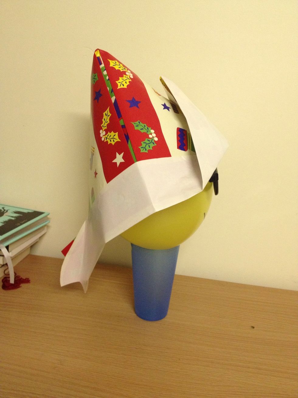 It is a very special hat,because here at the back of the hat there is a long part that can protect the spinal cord(explain in your funny way of what spinal cord isyou can tickle one of the kid's neck)