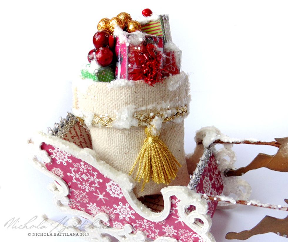 It is likely that weight of the deer will tip your sleigh forward. Fill the sleigh with a little sack of presents to weigh it down and keep it in place.