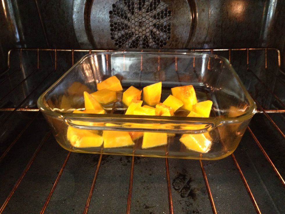It is much much easier to just buy a can of pumpkin. But, I had this butternut squash so I used that. Oven heats to 400 degrees, toss the squash in olive oil, and throw it in there.
